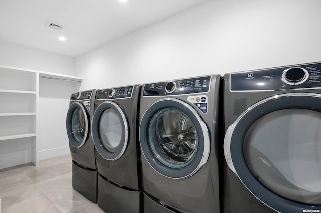 washroom with separate washer and dryer