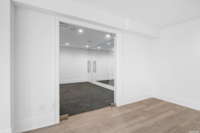 empty room featuring wood-type flooring