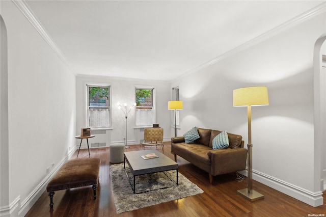 living room with dark hardwood / wood-style floors and ornamental molding