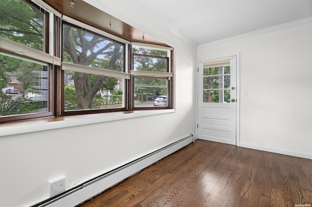 spare room with a healthy amount of sunlight, ornamental molding, dark wood-type flooring, and a baseboard radiator