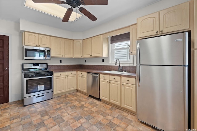 kitchen with ceiling fan, sink, and appliances with stainless steel finishes