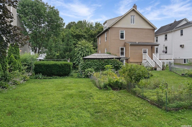 back of house with a yard