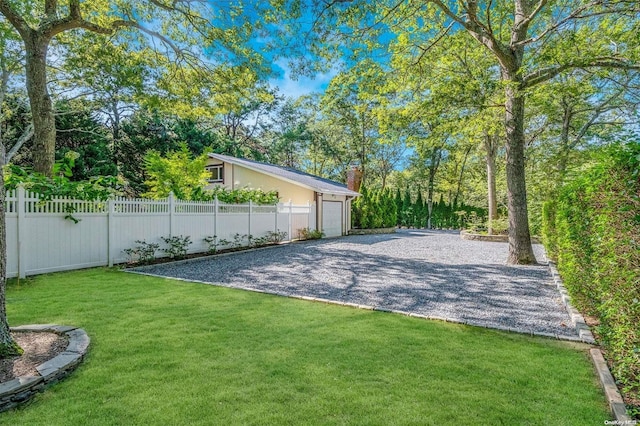 view of basketball court with a lawn