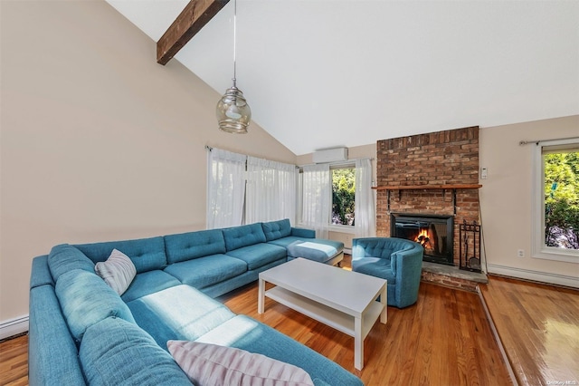 living room featuring hardwood / wood-style flooring, plenty of natural light, and beam ceiling