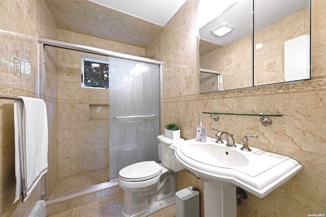 bathroom with walk in shower, decorative backsplash, toilet, and tile walls