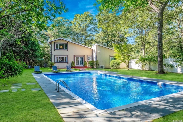 view of pool featuring a yard