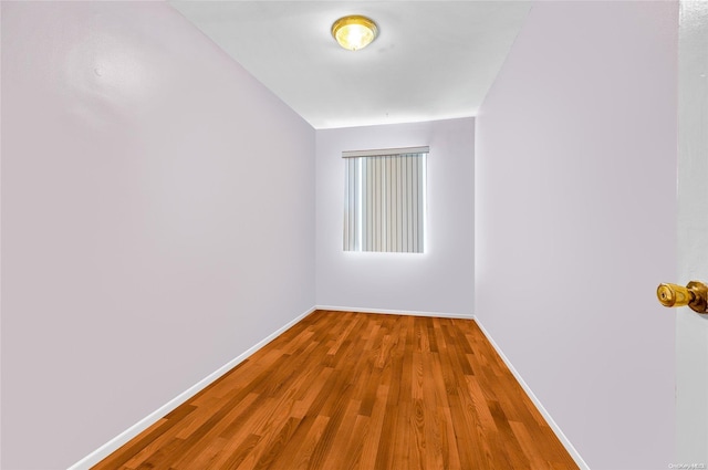 spare room with hardwood / wood-style floors