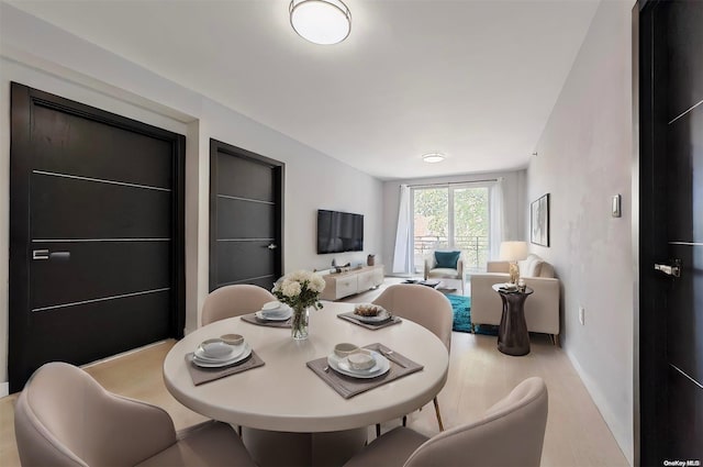 dining room featuring light hardwood / wood-style flooring