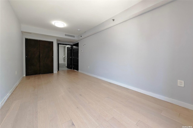 unfurnished bedroom with light hardwood / wood-style floors