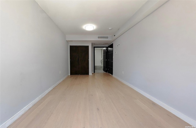 hallway featuring light wood-type flooring