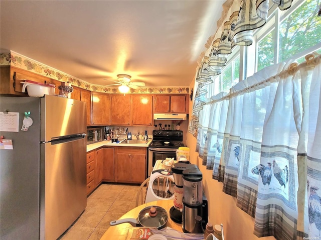 kitchen featuring black appliances, ceiling fan, and light tile patterned flooring