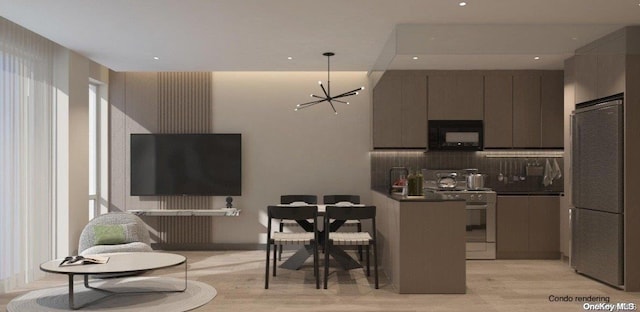 kitchen with stainless steel fridge, light wood-type flooring, tasteful backsplash, white range oven, and a chandelier