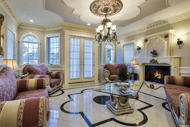 living room with ornamental molding, light tile patterned floors, and a chandelier