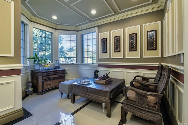 living area with ornamental molding