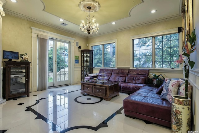 tiled living room featuring a notable chandelier and ornamental molding