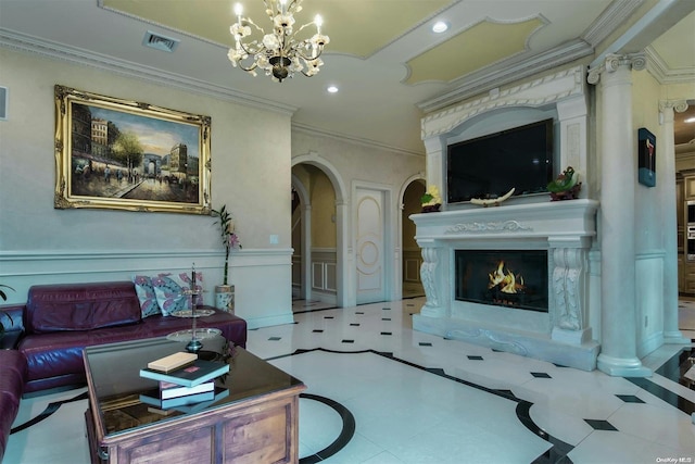 living room with ornamental molding and a notable chandelier