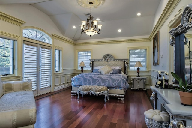 bedroom with dark hardwood / wood-style flooring, a chandelier, and lofted ceiling