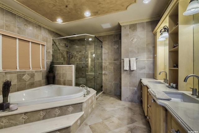 bathroom featuring vanity, crown molding, plus walk in shower, and tile walls