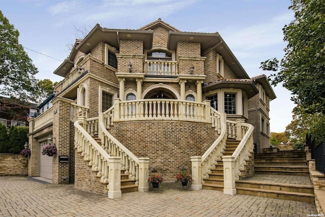 view of front of house with a balcony and a garage