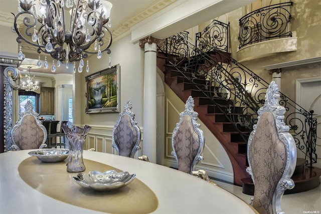 dining room featuring decorative columns and ornamental molding