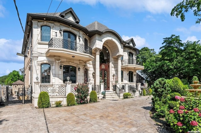 view of front of property with a balcony