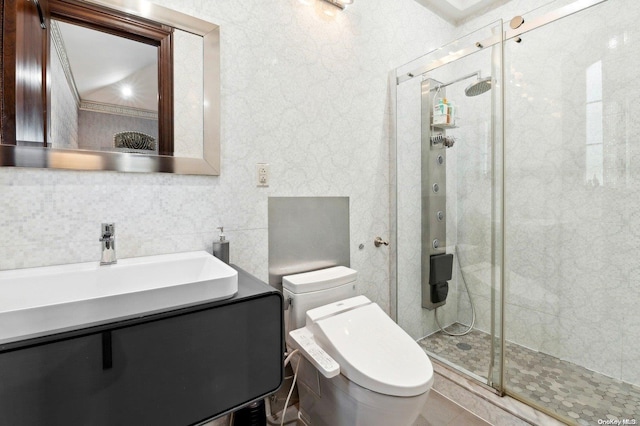 bathroom featuring tasteful backsplash, tile patterned flooring, toilet, vanity, and a shower with shower door