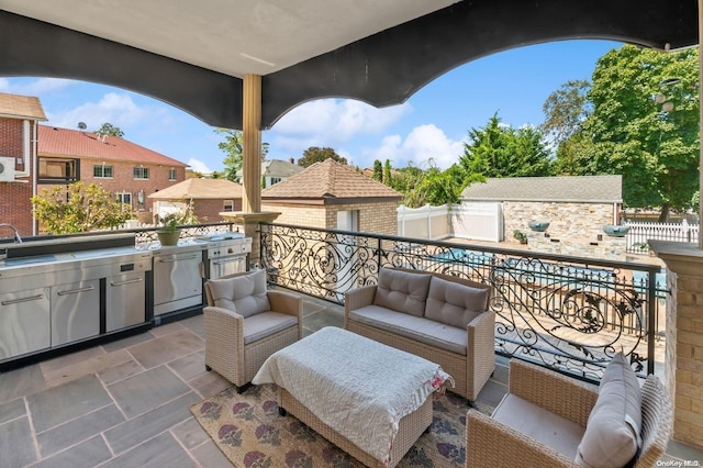 balcony featuring an outdoor hangout area, area for grilling, and sink