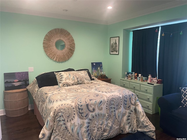 bedroom featuring crown molding and dark hardwood / wood-style floors