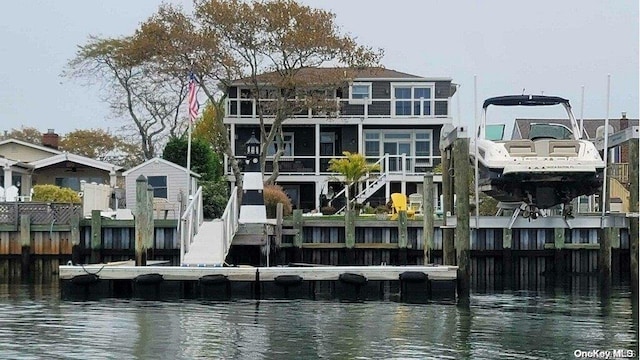 back of house featuring a water view