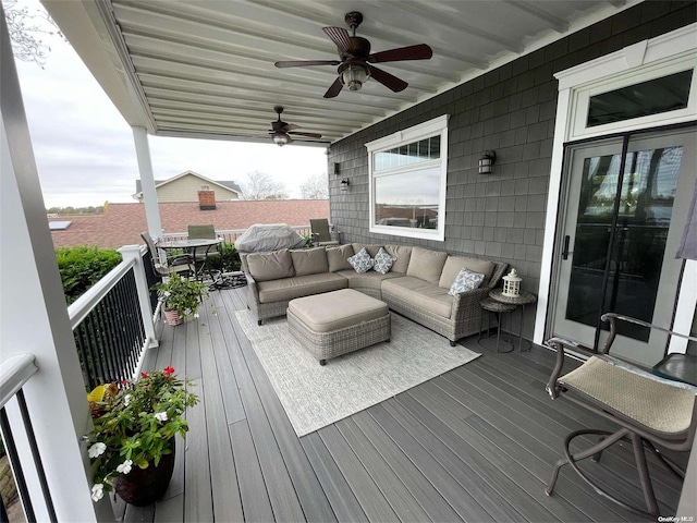 wooden deck with an outdoor living space