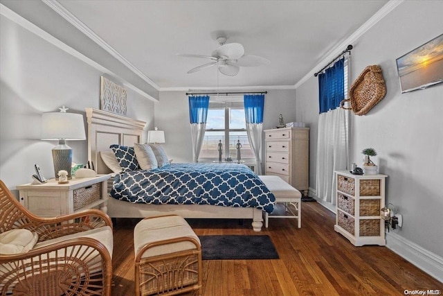 bedroom featuring dark hardwood / wood-style floors, ceiling fan, and crown molding