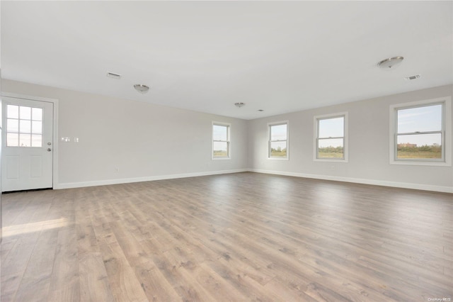 spare room featuring light hardwood / wood-style floors