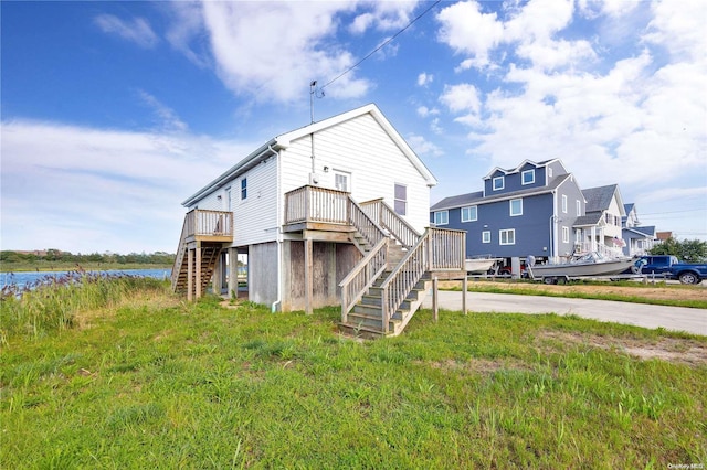 back of property with a water view