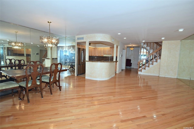 dining space featuring light hardwood / wood-style floors