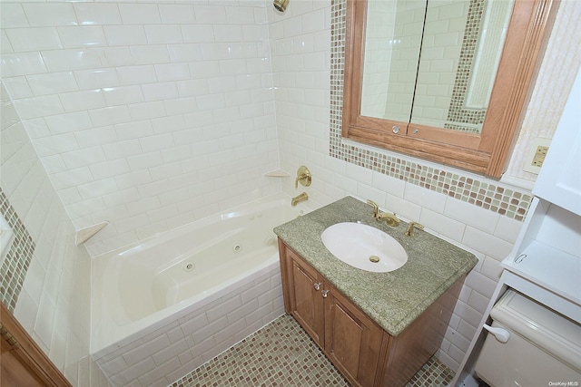 bathroom featuring tile patterned floors, tiled shower / bath combo, tile walls, and vanity