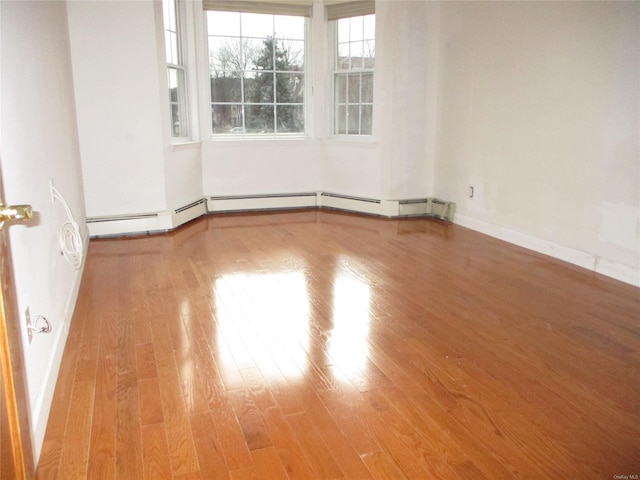 spare room featuring hardwood / wood-style floors