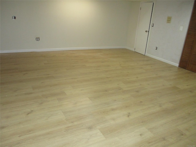 spare room featuring light hardwood / wood-style floors