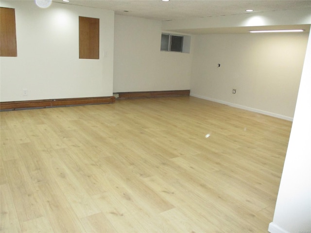 basement featuring light hardwood / wood-style flooring