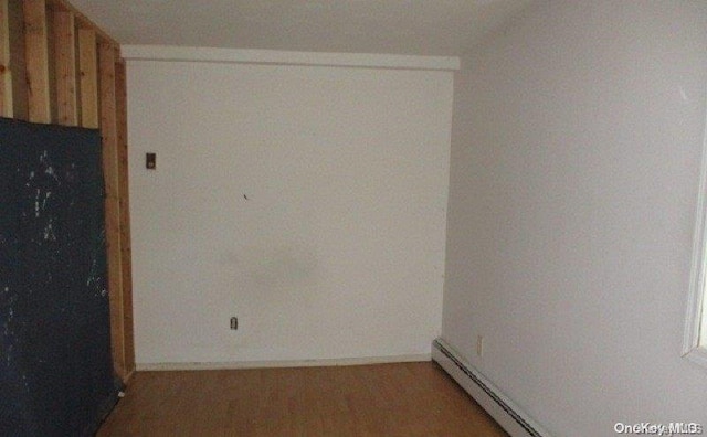 spare room with a baseboard heating unit