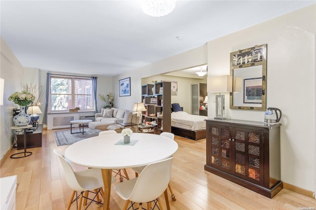 dining room with light hardwood / wood-style flooring