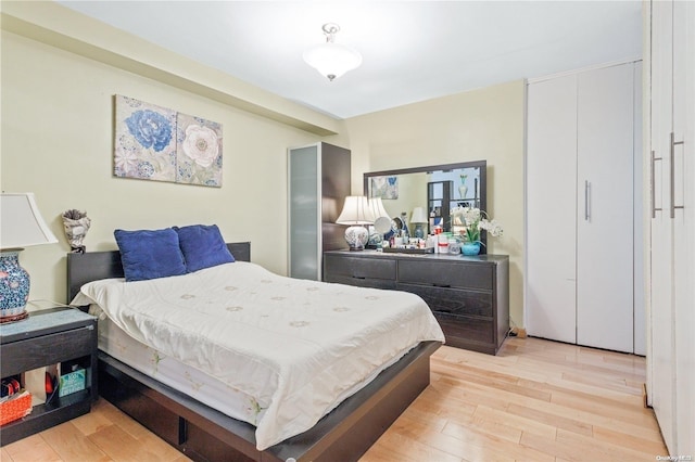 bedroom with light wood-type flooring