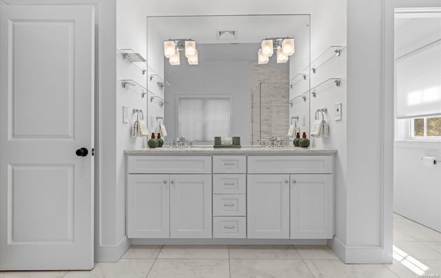 bathroom featuring tile patterned flooring and vanity