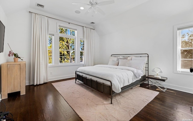 bedroom with ceiling fan, lofted ceiling, and multiple windows