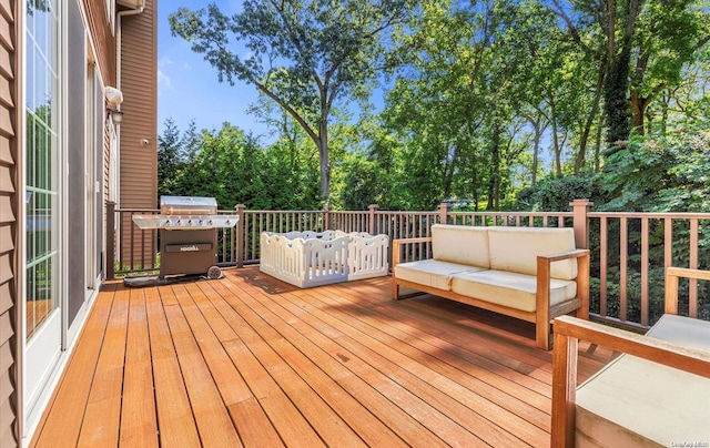 wooden terrace with outdoor lounge area