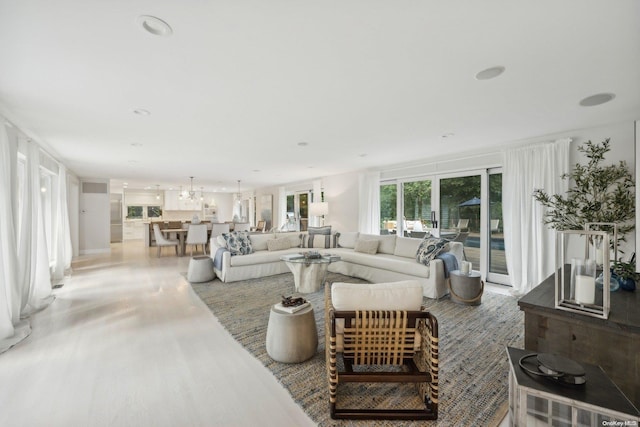 living room featuring a notable chandelier