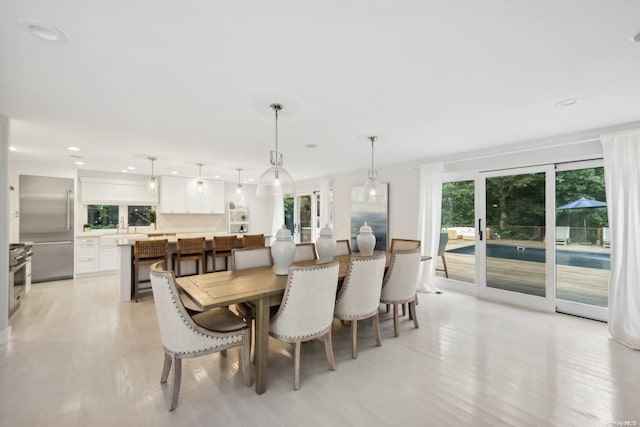 dining space featuring light hardwood / wood-style floors