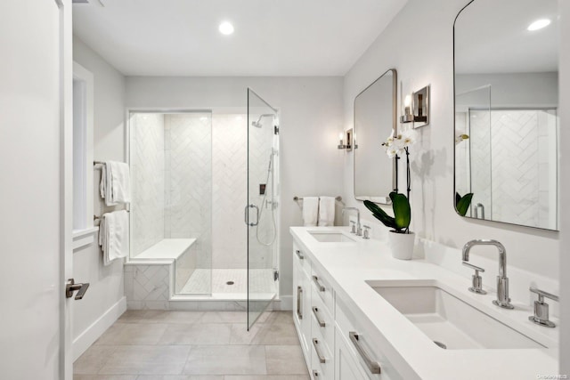 bathroom featuring vanity, tile patterned floors, and a shower with door