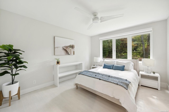 bedroom featuring ceiling fan and light wood-type flooring