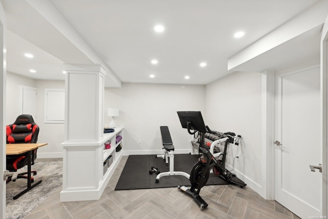 exercise room with light parquet floors