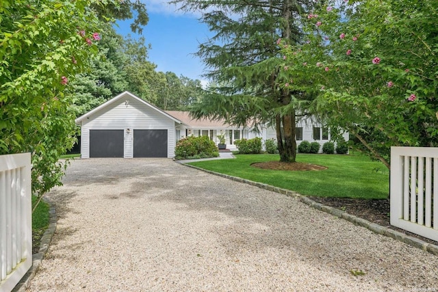 view of front facade with a front lawn and a garage